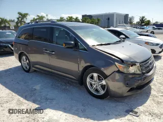 2011 Honda Odyssey Touring with VIN 5FNRL5H97BB501213, listed as a Copart auction lot 57314115 with 283,538 mi miles and Salvage title. Bid and sale history available at DreamBid. Image 4.