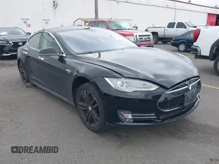 2014 Tesla Model S 60 with VIN 5YJSA1H10EFP48975, listed as a IAAI auction lot 42249935 with 105,524 mi miles and . Bid and sale history available at DreamBid. Image 1.
