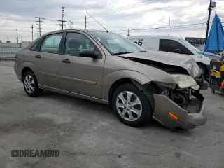 2005 Ford Focus S with VIN 1FAFP34N55W105530, listed as a Copart auction lot 59186695 with 136,204 mi miles and Salvage title. Bid and sale history available at DreamBid. Image 4.