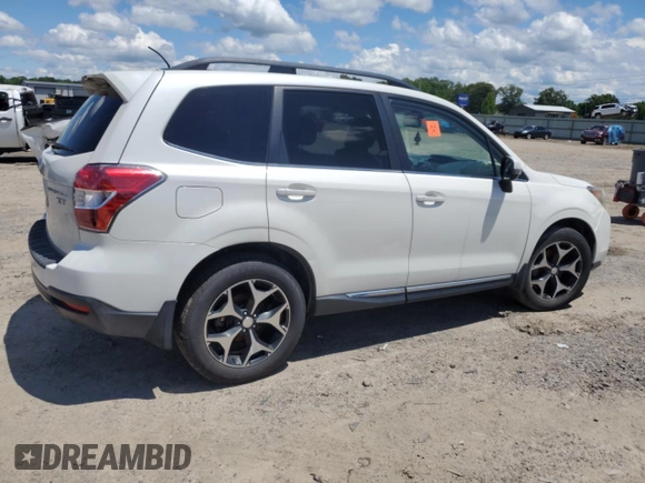 2015 Subaru Forester XT Touring with VIN JF2SJGUC4FH452824, listed as a Copart auction lot 56219615 with 127,328 mi miles and Salvage title. Bid and sale history available at DreamBid. Image 3.