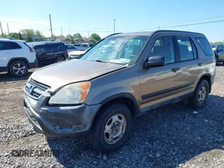2002 Honda CR-V LX z VIN JHLRD78402C068542, wystawiony jako IAAI lot #42265409 z przebiegiem 205 650 mil mil oraz . Historia ofert i sprzedaży dostępna na DreamBid. Obrazek 2.
