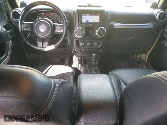 2013 Jeep Wrangler Unlimited Rubicon 10th Anniversary with VIN 1C4HJWFG4DL549065, listed as a Copart auction lot 75899594 with 127,960 mi miles and Salvage title. Bid and sale history available at DreamBid. Image 8.