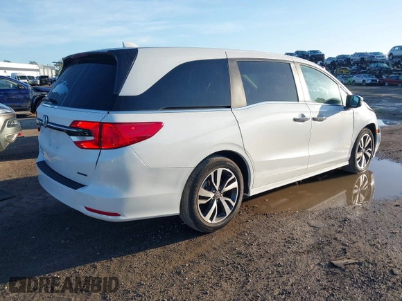 2022 Honda Odyssey Touring with VIN 5FNRL6H85NB058948, listed as a IAAI auction lot 42579157 with 53,669 mi miles and . Bid and sale history available at DreamBid. Image 4.