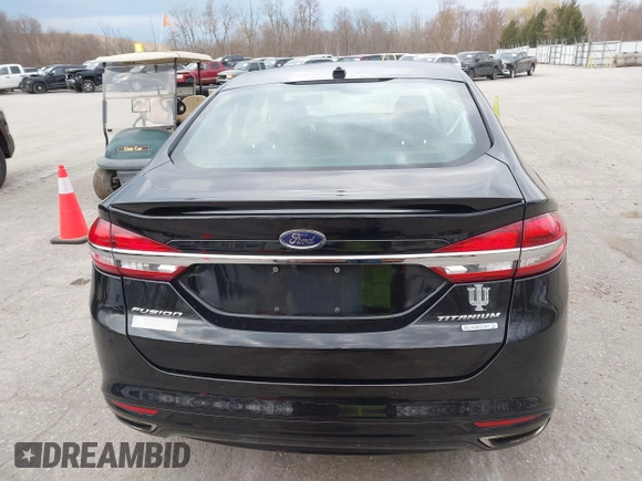 2017 Ford Fusion Titanium z VIN 3FA6P0K98HR200272, wystawiony jako IAAI lot #41905017 z przebiegiem 104 132 mil mil oraz . Historia ofert i sprzedaży dostępna na DreamBid. Obrazek 16.