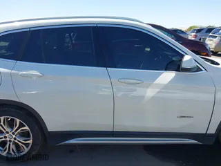2017 BMW X1 xDrive28i with VIN WBXHT3C30H5F68187, listed as a IAAI auction lot 41830892 with 101,313 mi miles. Bid and sale history available at carsss.com. Image 13.