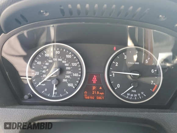 2012 BMW X5 35i z VIN 5UXZV4C54CL990840, wystawiony jako Copart lot #57715245 z przebiegiem 166 192 mil mil oraz Szkoda całkowita • Salvage title. Historia ofert i sprzedaży dostępna na DreamBid. Obrazek 9.