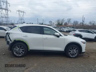 2020 Mazda CX-5 Grand Touring with VIN JM3KFBDM5L0731373, listed as a IAAI auction lot 41900567 with 31,268 mi miles and . Bid and sale history available at DreamBid. Image 13.