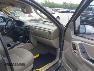 2002 Jeep Grand Cherokee Laredo with VIN 1J4GX48S42C313801, listed as a IAAI auction lot 42297223 with 153,633 mi miles and . Bid and sale history available at DreamBid. Image 5.