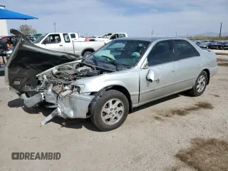 2000 Toyota Camry LE z VIN JT2BF28K0Y0261092, wystawiony jako Copart lot #58008665 z przebiegiem Nie podano mil oraz Szkoda całkowita • Salvage title. Historia ofert i sprzedaży dostępna na DreamBid. Obrazek 1.