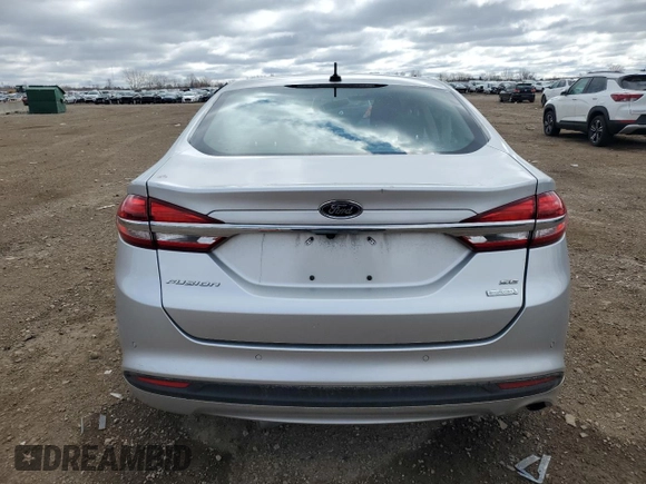 2018 Ford Fusion SE с VIN 3FA6P0HDXJR130582, выставлен на аукционе Copart как лот 53169815 с пробегом 137 512 миль миль и Списание • Salvage title. История ставок и продаж доступна на DreamBid. Изображение 6.