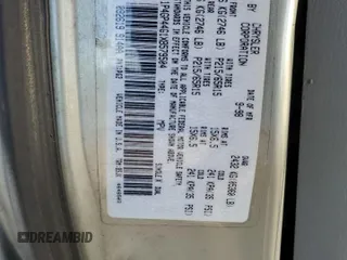 1999 Plymouth Voyager Grand SE z VIN 1P4GP44G1XB579504, wystawiony jako Copart lot #50064475 z przebiegiem Nie podano mil oraz Nie do naprawy. Historia ofert i sprzedaży dostępna na DreamBid. Obrazek 14.