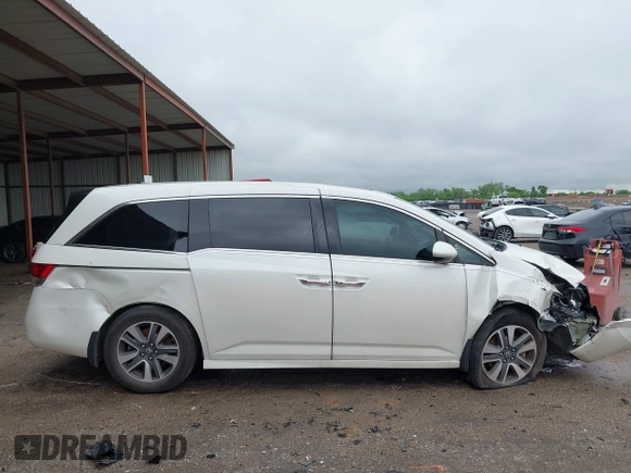 2014 Honda Odyssey Touring with VIN 5FNRL5H95EB059729, listed as a IAAI auction lot 42148110 with 135,304 mi miles and . Bid and sale history available at DreamBid. Image 14.