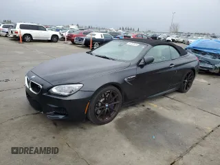 2014 BMW M6 z VIN WBSLZ9C50EDZ78599, wystawiony jako Copart lot #84724974 z przebiegiem 115 051 mil mil oraz Czysty tytuł • Clean title. Historia ofert i sprzedaży dostępna na DreamBid. Obrazek 1.