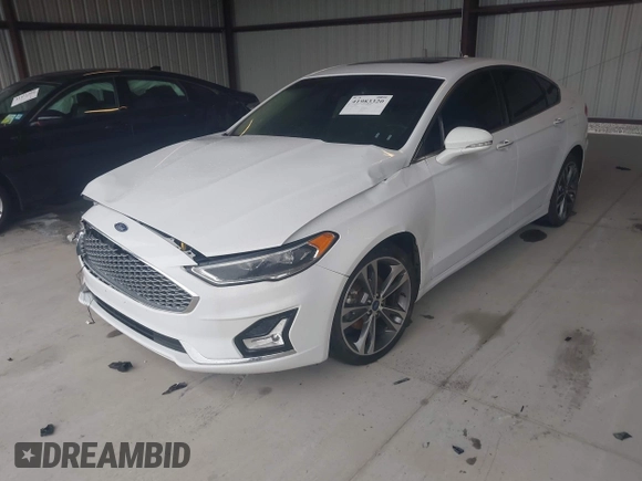 2019 Ford Fusion Titanium with VIN 3FA6P0K95KR271291, listed as a IAAI auction lot 41983320 with 71,962 mi miles and . Bid and sale history available at DreamBid. Image 2.