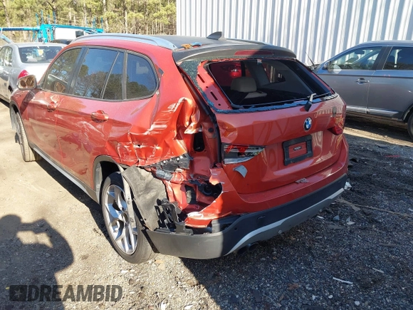 2015 BMW X1 xDrive28i with VIN WBAVL1C58FVY24900, listed as a IAAI auction lot 41772097 with 128,001 mi miles. Bid and sale history available at carsss.com. Image 6.