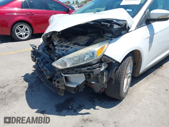 2016 Ford Focus SE z VIN 1FADP3F23GL338496, wystawiony jako IAAI lot #42333608 z przebiegiem 76 972 mil mil oraz . Historia ofert i sprzedaży dostępna na DreamBid. Obrazek 6.