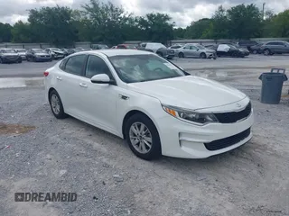 2017 Kia Optima LX z VIN 5XXGT4L32HG161091, wystawiony jako IAAI lot #42266149 z przebiegiem 166 254 mil mil oraz . Historia ofert i sprzedaży dostępna na DreamBid. Obrazek 1.