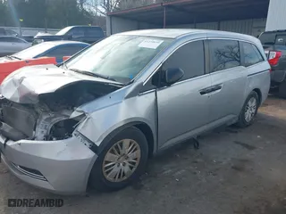 2015 Honda Odyssey LX with VIN 5FNRL5H27FB027143, listed as a IAAI auction lot 41239939 with 125,732 mi miles. Bid and sale history available at carsss.com. Image 2.