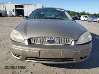 2004 Ford Taurus SE z VIN 1FAFP53284A156633, wystawiony jako Copart lot #58164985 z przebiegiem 91 246 mil mil oraz Szkoda całkowita • Salvage title. Historia ofert i sprzedaży dostępna na DreamBid. Obrazek 5.