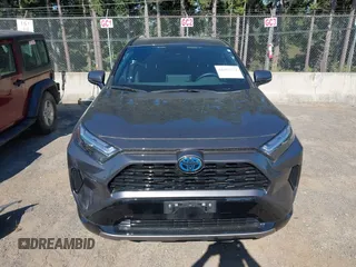 2022 Toyota RAV4 Hybrid SE z VIN 4T3T6RFV5NU101105, wystawiony jako IAAI lot #42666372 z przebiegiem 7 644 mil mil oraz . Historia ofert i sprzedaży dostępna na DreamBid. Obrazek 13.