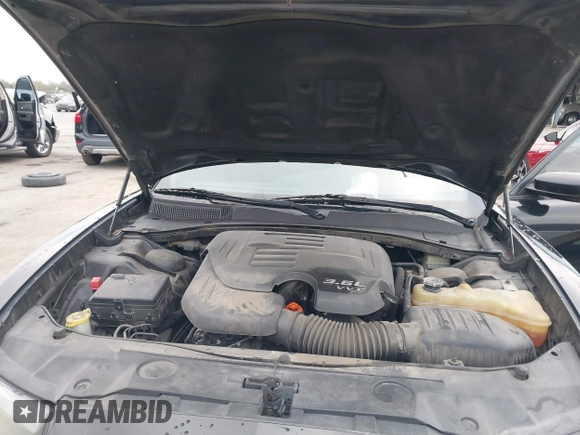 2014 Dodge Charger SE with VIN 2C3CDXBG2EH187978, listed as a IAAI auction lot 41246875 with 106,635 mi miles and . Bid and sale history available at DreamBid. Image 10.