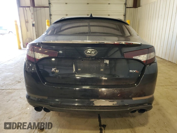 2013 Kia Optima SX с VIN 5XXGR4A69DG129650, выставлен на аукционе Copart как лот 50353705 с пробегом 231 319 миль миль и Списание • Salvage title. История ставок и продаж доступна на DreamBid. Изображение 6.