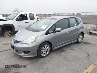 2009 Honda Fit Sport with VIN JHMGE88469S063030, listed as a IAAI auction lot 42064670 with 156,791 mi miles. Bid and sale history available at carsss.com. Image 2.