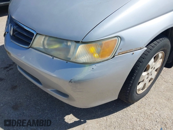 2002 Honda Odyssey EX-L z VIN 5FNRL18062B011890, wystawiony jako IAAI lot #41972294 z przebiegiem 245 889 mil mil oraz . Historia ofert i sprzedaży dostępna na DreamBid. Obrazek 13.