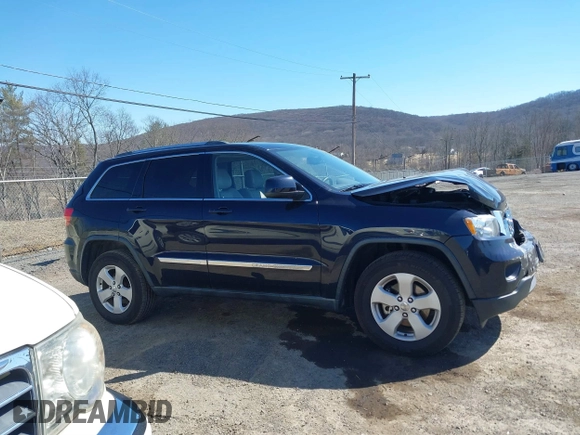 2011 Jeep Grand Cherokee Laredo with VIN 1J4RR4GG3BC670712, listed as a IAAI auction lot 41738127 with 93,714 mi miles and . Bid and sale history available at DreamBid. Image 13.