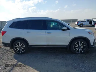 2022 Honda Pilot Touring 7-Passenger with VIN 5FNYF6H67NB017660, listed as a IAAI auction lot 41194603 with 87,301 mi miles. Bid and sale history available at carsss.com. Image 13.