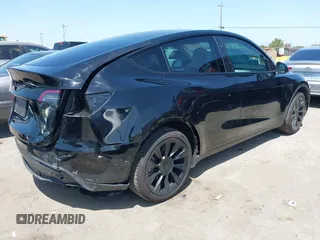 2024 Tesla Model Y with VIN 7SAYGDED9RF191453, listed as a IAAI auction lot 42272051 with 7,805 mi miles and . Bid and sale history available at DreamBid. Image 4.