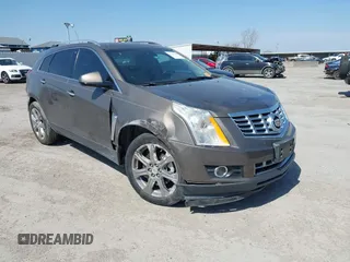 2015 Cadillac SRX Performance Collection with VIN 3GYFNCE31FS598109, listed as a IAAI auction lot 41788267 with 172,488 mi miles and . Bid and sale history available at DreamBid. Image 1.