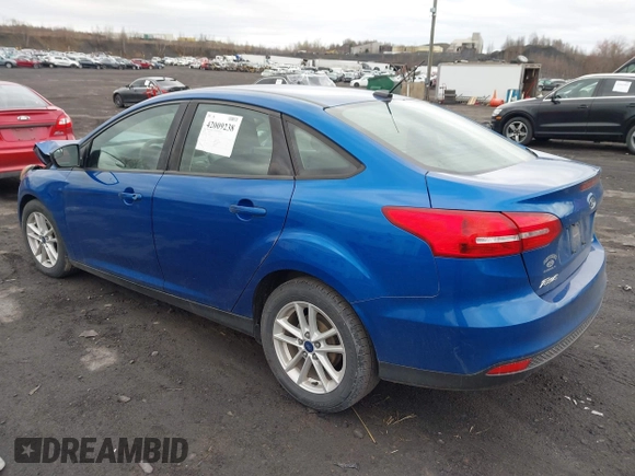 2018 Ford Focus SE z VIN 1FADP3F23JL200674, wystawiony jako IAAI lot #42009238 z przebiegiem 78 007 mil mil oraz . Historia ofert i sprzedaży dostępna na DreamBid. Obrazek 3.