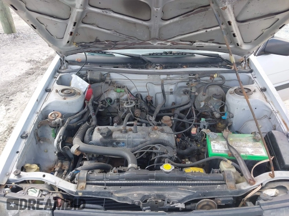 1986 Toyota Corolla with VIN JT2AE82E7G3318230, listed as a IAAI auction lot 42042219 with 74,689 mi miles and . Bid and sale history available at DreamBid. Image 10.