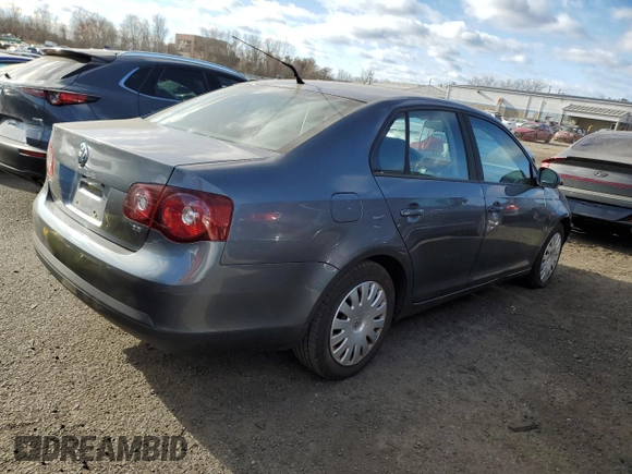 2009 Volkswagen Jetta z VIN 3VWHZ71KX9M011693, wystawiony jako Copart lot #87076904 z przebiegiem 157 478 mil mil oraz Szkoda całkowita • Salvage title. Historia ofert i sprzedaży dostępna na DreamBid. Obrazek 3.