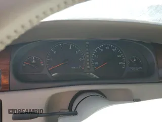 2000 Cadillac Eldorado z VIN 1G6EL12Y7YU198685, wystawiony jako Copart lot #75093094 z przebiegiem Nie podano mil oraz Szkody całkowita. Historia ofert i sprzedaży dostępna na DreamBid. Obrazek 9.
