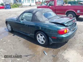 1999 Mazda MX-5 Miata z VIN JM1NB3537X0123440, wystawiony jako IAAI lot #42263294 z przebiegiem 107 356 mil mil oraz . Historia ofert i sprzedaży dostępna na DreamBid. Obrazek 3.