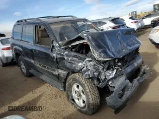 2000 Toyota Land Cruiser with VIN JT3HT05J6Y0086734, listed as a Copart auction lot 84870974 with 228,873 mi miles and Clean Title. Bid and sale history available at carsss.com. Image 4.