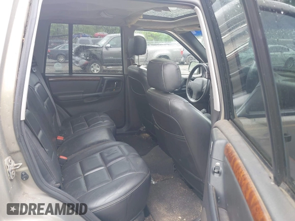 1998 Jeep Grand Cherokee Limited z VIN 1J4GZ78Y5WC261391, wystawiony jako IAAI lot #42275913 z przebiegiem 180 552 mil mil oraz . Historia ofert i sprzedaży dostępna na DreamBid. Obrazek 8.
