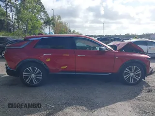 2024 Cadillac LYRIQ Luxury z VIN 1GYKPRRKXRZ137625, wystawiony jako IAAI lot #41570493 z przebiegiem 3 859 mil mil oraz . Historia ofert i sprzedaży dostępna na DreamBid. Obrazek 13.