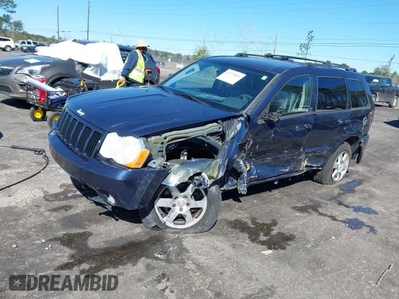 2009 Jeep Grand Cherokee Laredo with VIN 1J8HR48P19C540785, listed as a IAAI auction lot 41729851 with 205,504 mi miles. Bid and sale history available at carsss.com. Image 2.
