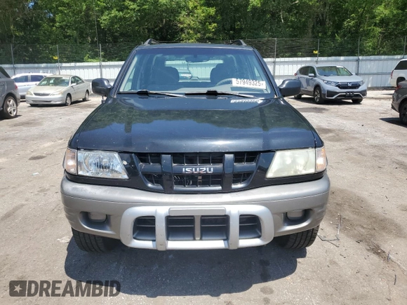 2003 Isuzu Rodeo z VIN 4S2CK58W734311374, wystawiony jako Copart lot #57949325 z przebiegiem 247 580 mil mil oraz Tytuł czysty. Historia ofert i sprzedaży dostępna na DreamBid. Obrazek 5.