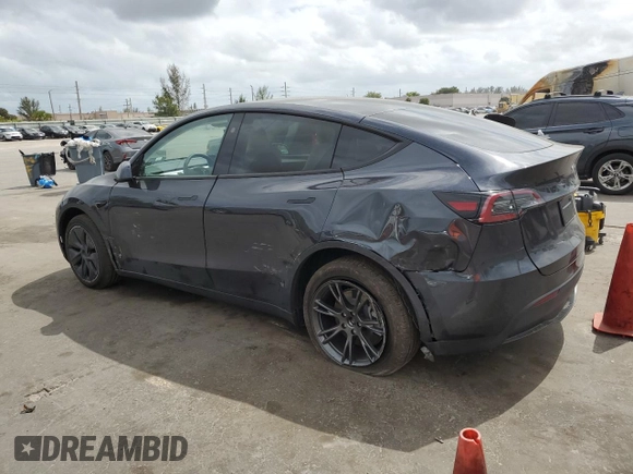 2025 Tesla Model Y Long Range with VIN 7SAYGDED6SF228626, listed as a Copart auction lot 47654525 with 2,087 mi miles and Salvage Title. Bid and sale history available at DreamBid. Image 2.