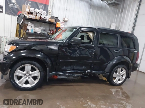2011 Dodge Nitro Heat with VIN 1D4PU4GK1BW602572, listed as a IAAI auction lot 41529030 with 134,482 mi miles. Bid and sale history available at carsss.com. Image 14.