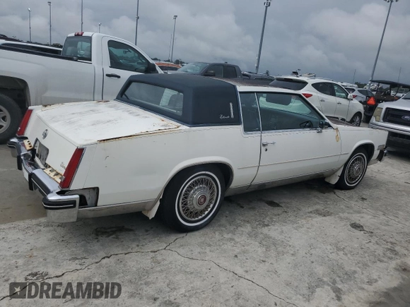 1984 Cadillac Eldorado z VIN 1G6AL5783EE654296, wystawiony jako Copart lot #74945374 z przebiegiem 37 040 mil mil oraz Szkoda całkowita • Salvage title. Historia ofert i sprzedaży dostępna na DreamBid. Obrazek 3.