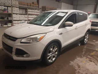 2013 Ford Escape SEL with VIN 1FMCU9H98DUD82751, listed as a IAAI auction lot 41575198 with 166,580 mi miles. Bid and sale history available at carsss.com. Image 2.