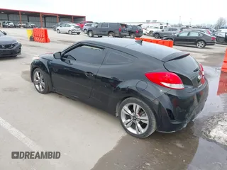 2013 Hyundai Veloster w/Black Int z VIN KMHTC6ADXDU149793, wystawiony jako IAAI lot #41537953 z przebiegiem 117 635 mil mil oraz . Historia ofert i sprzedaży dostępna na DreamBid. Obrazek 3.