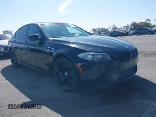 2013 BMW M5 with VIN WBSFV9C54DC772568, listed as a IAAI auction lot 41866486 with 99,072 mi miles. Bid and sale history available at carsss.com. Image 1.