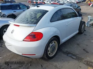 2014 Volkswagen Beetle 2.5L w/Sun with VIN 3VWJP7ATXEM628666, listed as a IAAI auction lot 41328014 with 70,990 mi miles and . Bid and sale history available at DreamBid. Image 4.