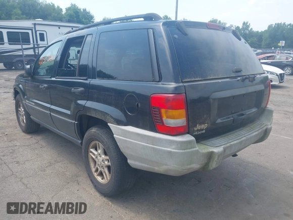 2003 Jeep Grand Cherokee Laredo with VIN 1J4GW48S03C557756, listed as a IAAI auction lot 42507884 with 195,236 mi miles and . Bid and sale history available at DreamBid. Image 3.
